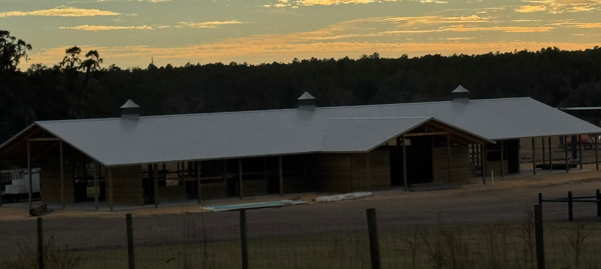 Farm building at sunset